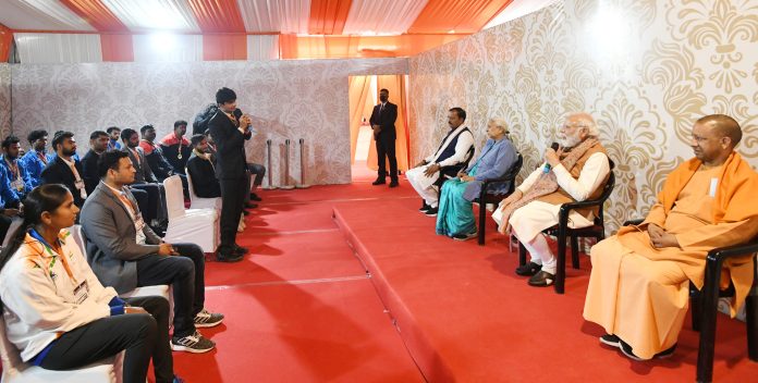 PM interacting with the sport persons, in Meerut, Uttar Pradesh on January 02, 2022. The Governor of Uttar Pradesh, Smt. Anandiben Patel and the Chief Minister of Uttar Pradesh, Yogi Adityanath are also seen.