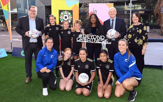 (L-R) Grant Robertson, New Zealand Deputy Prime Minister, with Fatma Samoura, FIFA Secretary General (third from right), Phil Goff, Mayor of Auckland, and Johanna Wood (NZ Football President, OFC Executive Committee Member and FIFA Council Member) with players during the FIFA Women's World Cup 2023 Draw announcement in Auckland on Friday 13 May 2022.