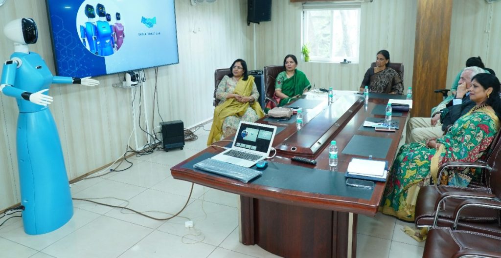 Smt. P. Sabitha Indra Reddy garu, Hon. Minister of Education, Telangana, watching the demonstration of teaching by Eagle Robot, developed by the Indus International School, at her office, today.