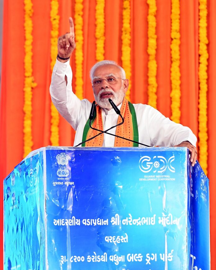 PM addressing the gathering at the laying of foundation stone and dedication to the Nation of Multiple Projects worth over Rs. 8000 crore, at Amod, Bharuch, in Gujarat on October 10, 2022.