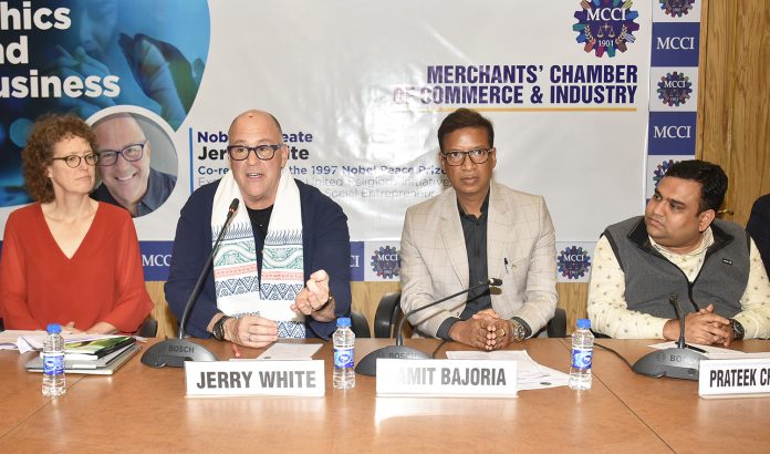 (L - R) : Ms. Alice Swett, Director of Global Operations, United Religions Initiative, Nobel Laureate - Mr. Jerry White, Co-recipient of the 1997 Nobel Peace Prize, Executive Director, United Religions Initiative, Senior Ashoka Fellow, Social Entrepreneur, Humanitarian Activist addressing the Session, Mr. Namit Bajoria, President, MCCI and Mr.Prateek Chaudhary, Committee Member, MCCI at the Special Session on ''Ethics and Business' held today at MCCI.