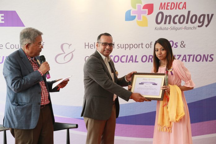 Dr. Subir Ganguly Sr Consultant & Advisor Medica Oncology and Dr. Abhay Kumar Head Of Department Urology, Surgical Oncology, and Robotic Surgery, Medica Superspecialty Hospital felicitating a cancer survivor