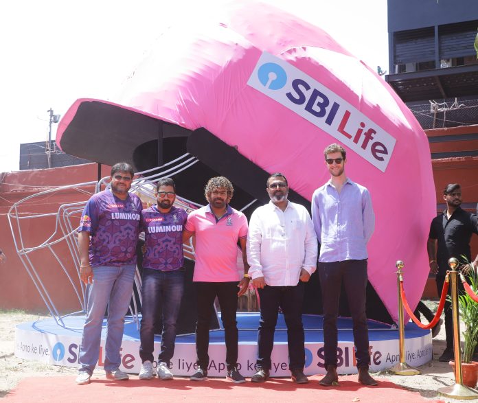 SBI Life Insurance and Rajasthan Royals franchise unveils a larger-than-life ‘helmet’ installation at Sawai Mansingh Stadium, Jaipur. The inauguration was done by Mr. Ravindra Sharma, Chief of Brand, Corporate Communication & CSR, SBI Life Insurance, and Mr. Jake Lush McCrum, Chief Executive Officer, Rajasthan Royals in presence of Separamadu Lasith Malinga, Fast Bowling Coach, Rajasthan Royals; Mr. Siddharth Lahiri, Assistant Coach & Head of Academy, Rajasthan Royals; Mr. Dishant Yagnik, Fielding Coach, Rajasthan Royals, and other respected dignitaries.