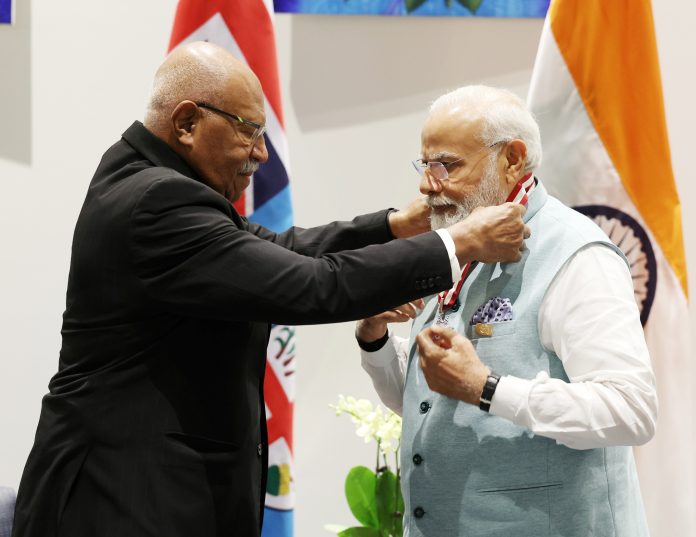 PM being conferred with Fijis highest honour Companion of the Order by the Prime Minister of the Republic of Fiji, Mr. Sitiveni Rabuka, at Port Moresby, in Papua New Guinea on May 22, 2023.