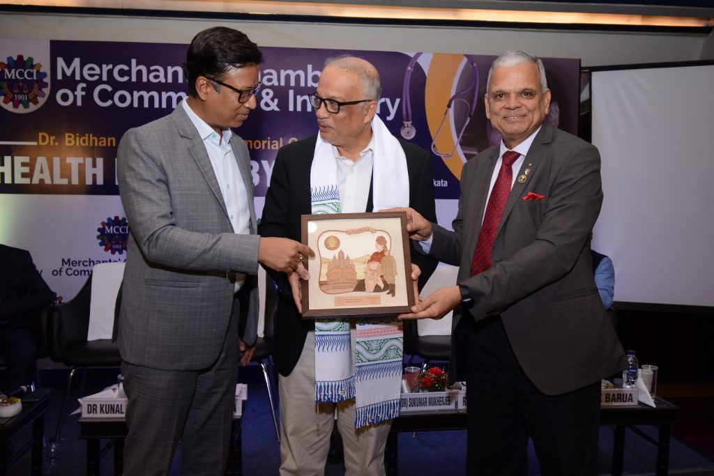 Shri Namit Bajoria, President MCCI presenting a memento to Dr.Kunal Sarkar. On his left - Shri Rajendra Khandelwal, Chairman, Council on Healthcare, MCCI at the Dr. Bidhan Chandra Roy Memorial Oration on "HEALTH FOR ALL BY 2030" held today at The Park Hotel, Kolkata.