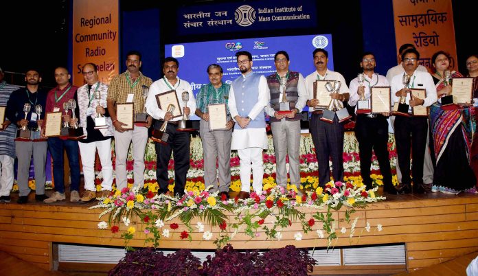 The Union Minister for Information & Broadcasting, Youth Affairs and Sports, Shri Anurag Singh Thakur in a group photograph at the inauguration event of Regional Community Radio Sammelan (North) at IIMC, in New Delhi on July 23, 2023.