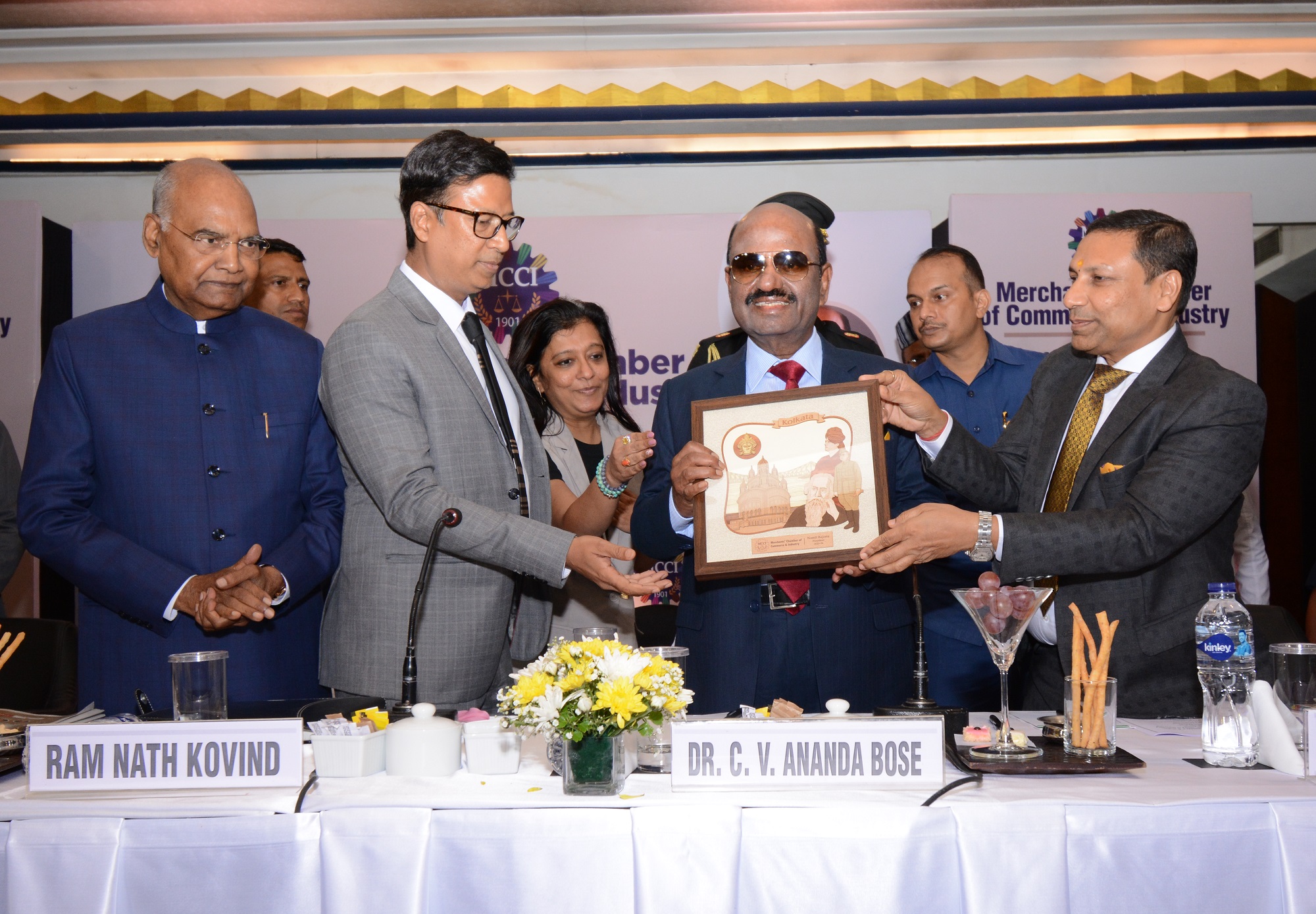 (L - R) :Shri Ram Nath Kovind, Hon'ble Former President of India, Shri Namit Bajoria, President, MCCI presenting a memento to Dr. C. V. Ananda Bose, Hon'ble Governor of West Bengal and Shri Lalit Beriwala, Sr. Vice President, MCCI at the Exclusive Session on 'Ethos of Indian Constitution : Unity in Diversity' held today at The Park Hotel, Kolkata.