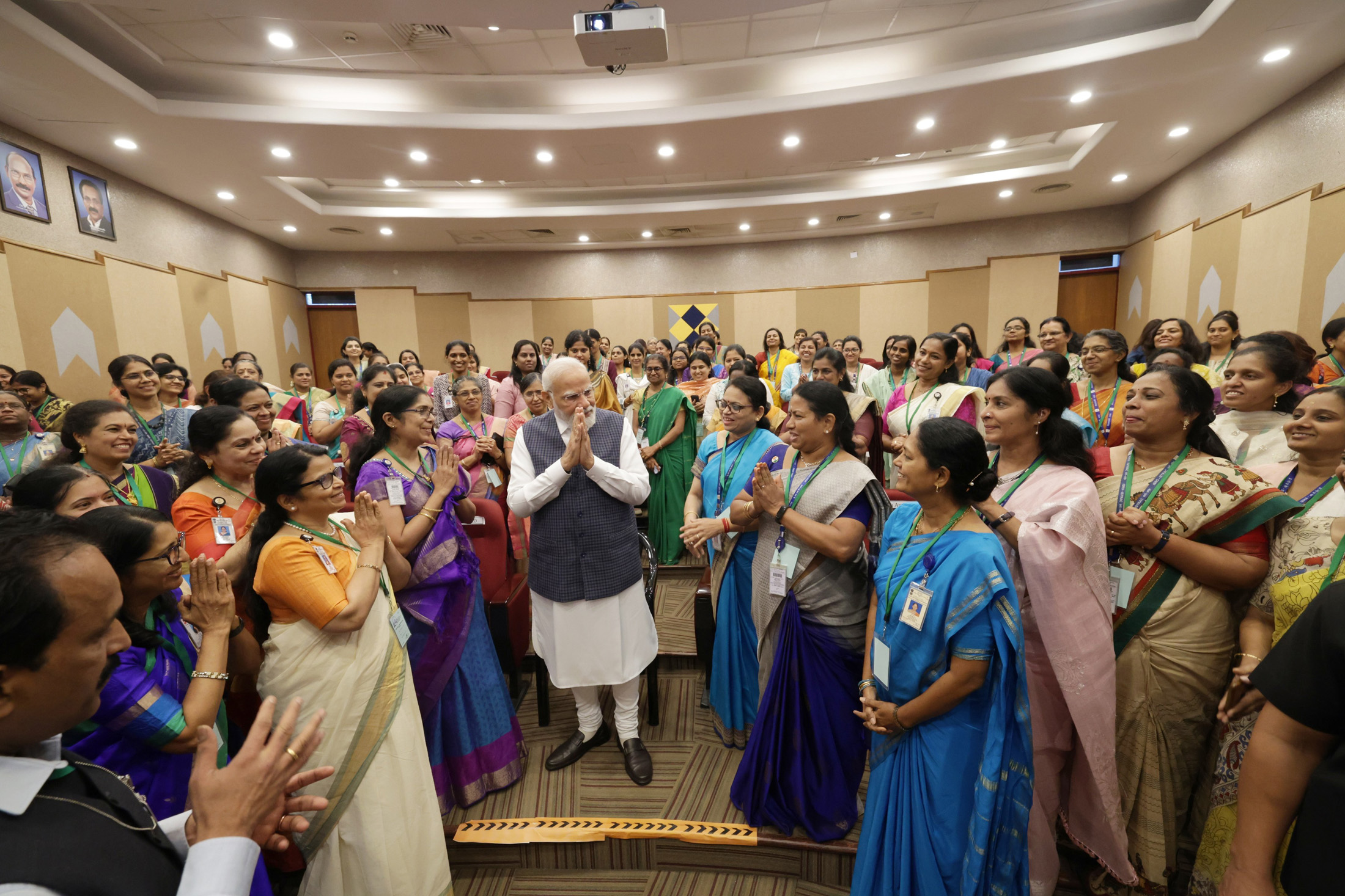 PM in a group photograph with the scientists of ISRO on success of Chandrayaan-3 Mission at the ISRO Telemetry Tracking and Command Network (ISTRAC), in Bengaluru on August 26, 2023.