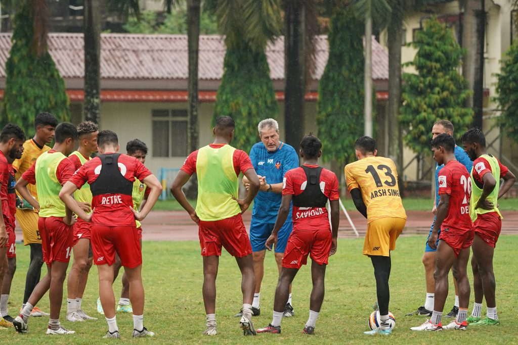 FC Goa coach Manolo Marquez (centre) making a point to his wards in training ahead of their final 132nd IndianOil Durand Cup Group game against Downtown Heroes.