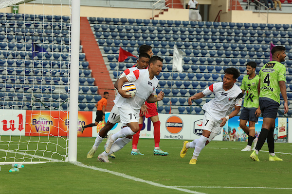 Brazilian Ibson Melo surrounded by teammates after scoring the equaliser for NorthEast United FC against Downtown Heroes in the 132nd IndianOil Durand Cup in Guwahati.