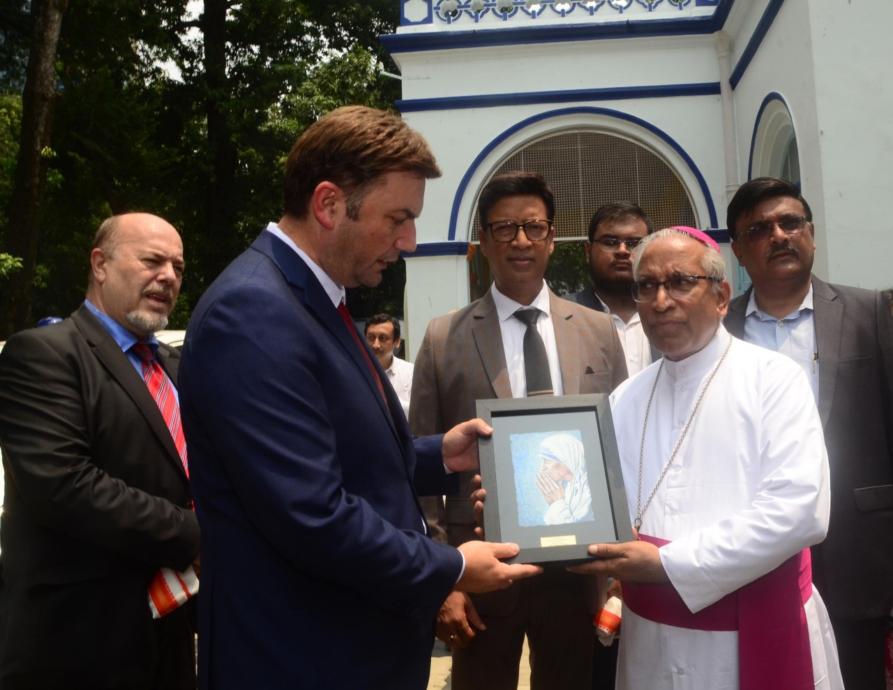 A delegation from The Republic of North Macedonia visited Kolkata and met the Archbishop at a function to pay homage to Mother Teresa. From left - His Excellency, Mr Slobodan Uzunov, Ambassador to India, His Excellency, Mr Bujar Osmani, Foreign Affairs Minister, Mr Namit Bajoria, Honorary Consul of the Republic of North Macedonia in Kolkata, Archbishop of Kolkata, His Grace, Thomas D'Souza handing over and framed picture of Mother Teresa to Mr Osmani at a function at the Archbishop House in Kolkata along with Mr Subrata Ganguly of Church Art.