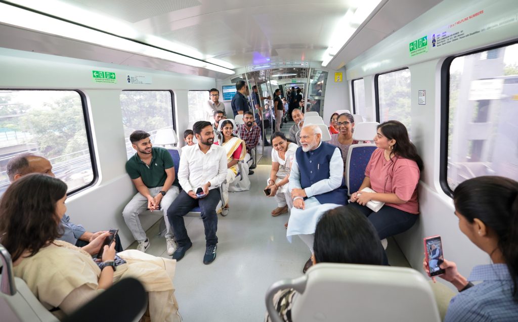 PM interacting with passengers during undertakes metro ride ahead of inauguration the extension of Delhi Airport Metro Express line from Dwarka Sector 21 to a new metro station Yashobhoomi Dwarka Sector 25, in New Delhi on September 17, 2023.