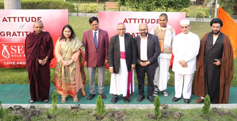 (L-R) Buddhist Priest - Shri Bodhijyoti Bhikk; Mrs. Joita Sen, Director and Head of Marketing and Design, Senco Gold & Diamonds; Shri. Debasish Sen, (IAS), Chairman-NKDA & MD- HIDCO; Rev. Thomas D’Souza, Roman Catholic Archbishop of Kolkata; Mr. Suvankar Sen, MD & CEO Senco Gold & Diamonds; Shri Shivaji Bhakta, Iskcon Monk; Jimmy Homi Taraporwalla, Parsi Priest and Muslim Shia Cleric & Haj Committee Member, Moulana Syed Meher Abbas Rizvi planting saplings at Senco Gold & Diamonds’ Attitude of Gratitude Event held at Newtown Business Club.