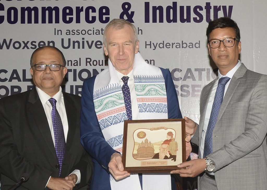 Mr. Namit Bajoria, President, MCCI presenting a memento to Mr. Yves Leterme, Former Prime Minister, Belgium at the National Round Table on "Glocalization in Education for the Future Businesses" held today (10 January, 2024) at  The Bengal Club, Kolkata  organised by MCCI  in association with  Woxsen University. On his right -Mr. Smarajit Mitra, Chairman, Council on Human Resource & Skill Development, MCCI.