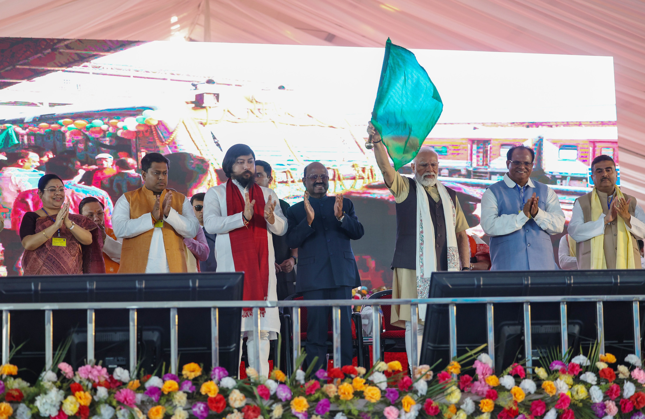 PM flags off new passenger train service between Siliguri and Radhikapur during the Viksit Bharat Viksit West Bengal program at Siliguri, in West Bengal on March 09, 2024.
