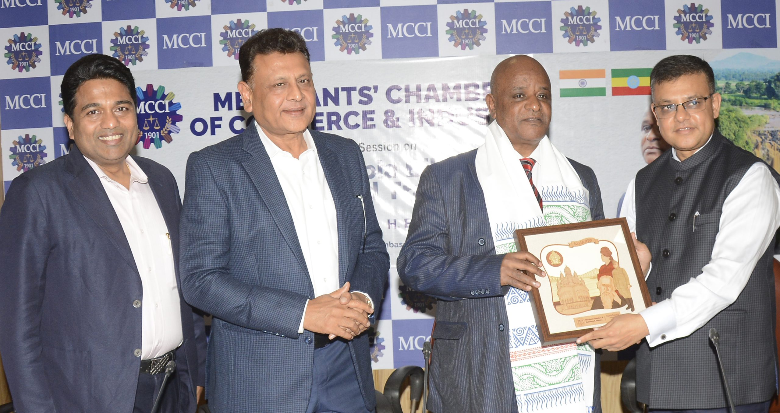 Mr. Rishabh C. Kothari, Immediate Past President, MCCI presenting a memento to H. E. Mr. Demeke Atnafu Ambulo, Ambassador Extraordinary and Plenipotentiary, Embassy of the Federal Democratic Republic of Ethiopia at a Special Session on India-Ethiopia Bilateral Ties & Trade held (TODAY) 10.04.2024 at MCCI. On his right - Mr. Srikant Jain, Co-Chairman, Council on Foreign Trade, MCCI and Mr. Ravi Agarwal, Committee Member, MCCI.