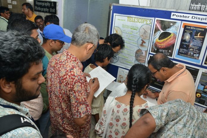 Participants are observing the Poster session in the Outreach Programme on “Cosmic Adventures: Celebrating the Life and Legacy of Prof. J. V. Narlikar” on 22nd September, 2025 (Monday) at ISI, Kolkata.