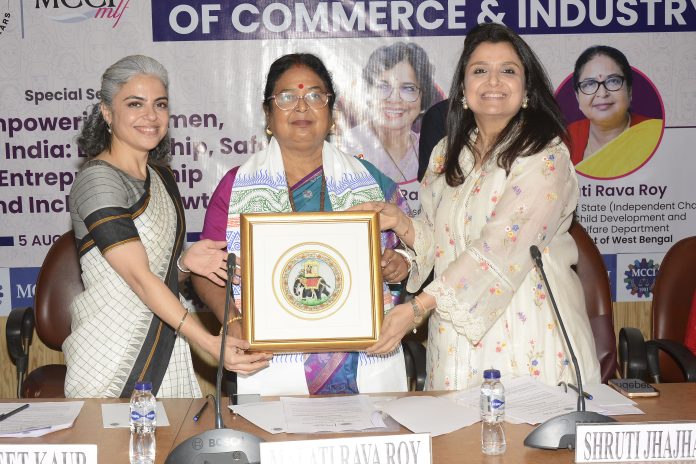 Shruti Jhajharia, Co-Chairperson, MCCI Ladies Forum and Jaspreet Kaur, Member, MCCI Ladies Forum & Director, JIS Group presenting a memento to Malati Rava Roy, Hon'ble Minister of Women & Child Development, Govt. of West Bengal at MCCI & MLF Special Session on "Empowering Women, Enabling India: Leadership, Safety, Entrepreneurship & Inclusive Growth" on 5 August 2026 at MCCI Conference Hall. Shruti Jhajharia, Co-Chairperson, MCCI Ladies Forum and Jaspreet Kaur, Member, MCCI Ladies Forum & Director, JIS Group presenting a memento to Malati Rava Roy, Hon'ble Minister of Women & Child Development, Govt. of West Bengal at MCCI & MLF Special Session on "Empowering Women, Enabling India: Leadership, Safety, Entrepreneurship & Inclusive Growth" on 5 August 2026 at MCCI Conference Hall.